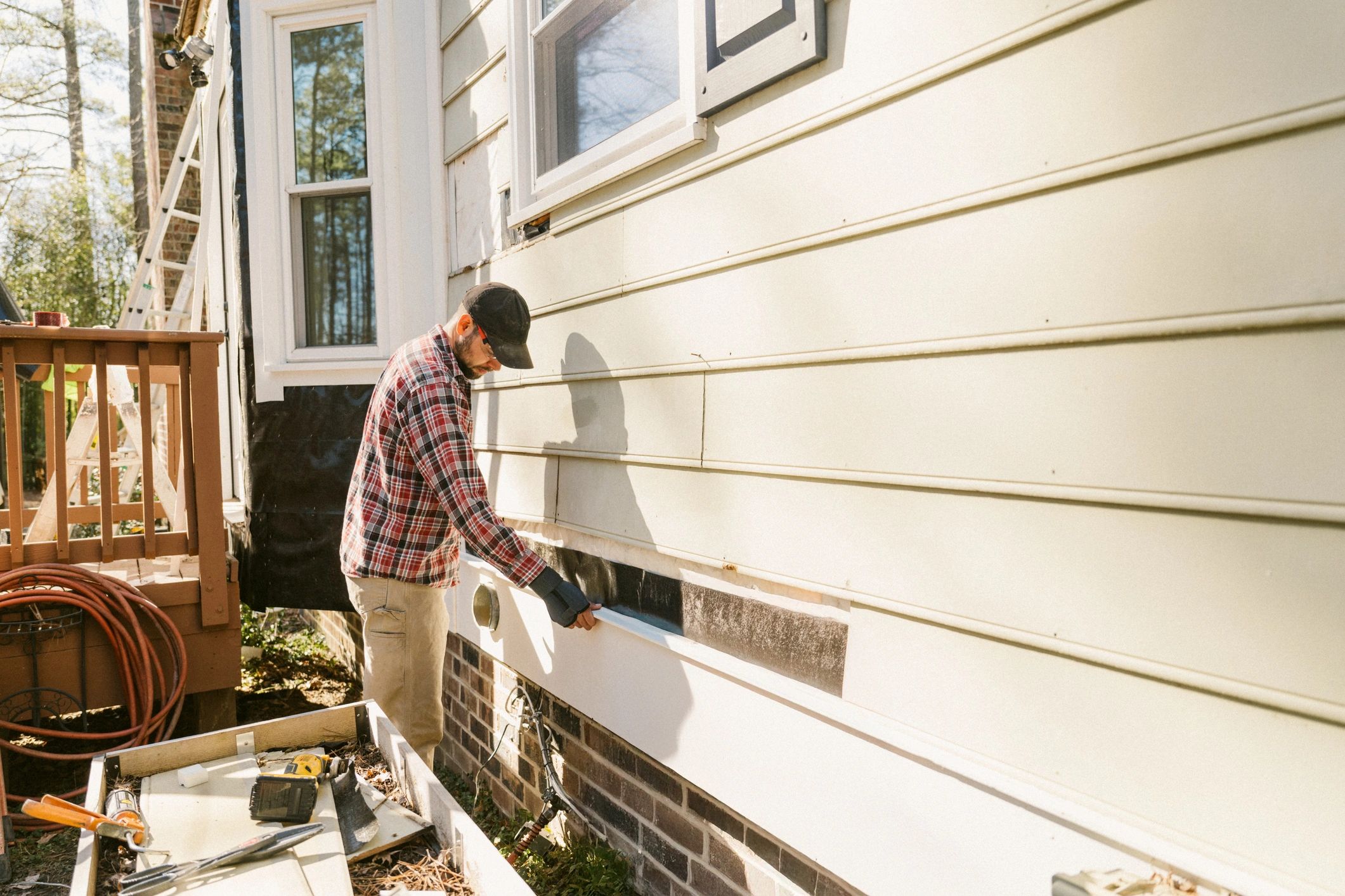 Home service technician outside residential property